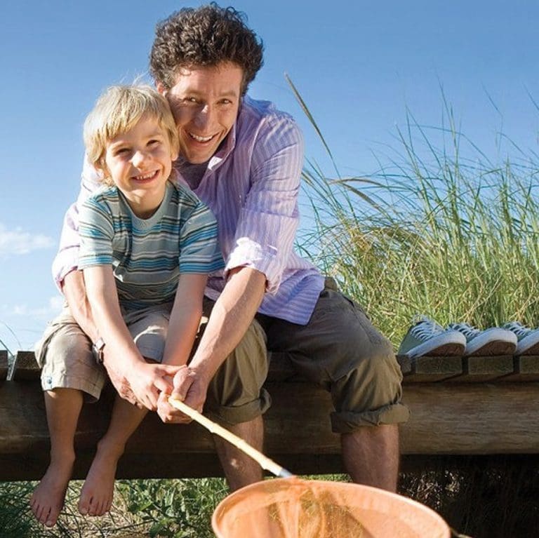 Father and son on a dock