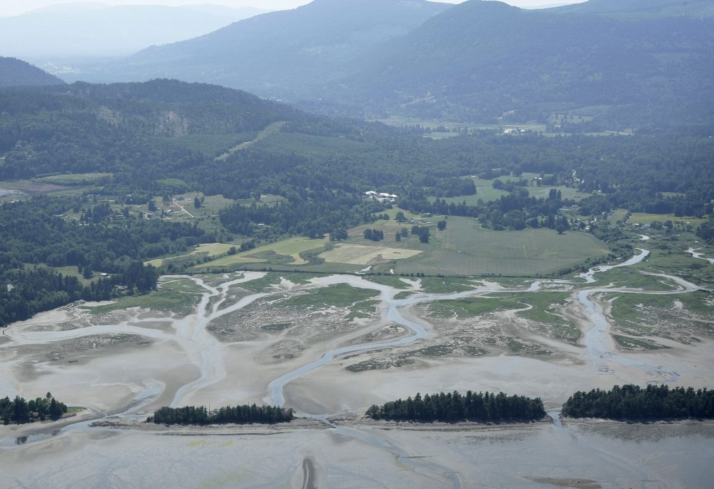 Estuary and mountain valley with roads