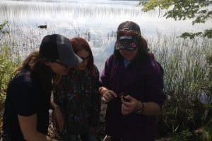 Students examine a crayfish found at the Bluewater Outdoor Education Centre