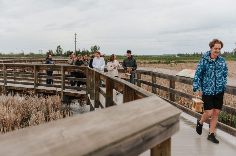 Group of students walking on boardwalk