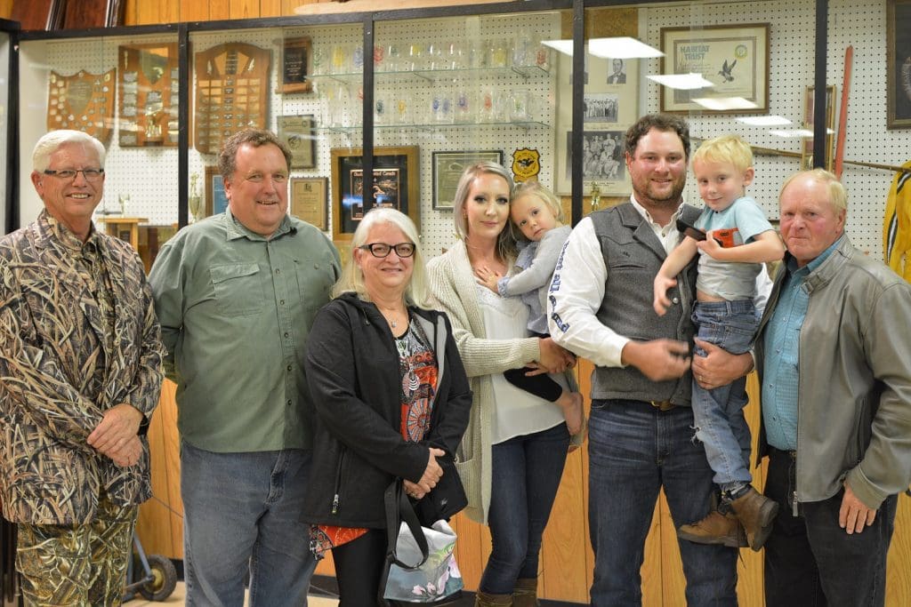 DUC’s chairman of the board Jim Couch and staffer Pat Kehoe (left) celebrate with the Young family