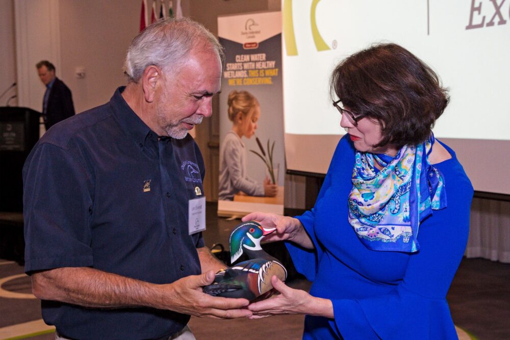 Lieutenant Governor of British Columbia celebrates with long-time volunteer, Len Everett, who was awarded for 30 years of service.