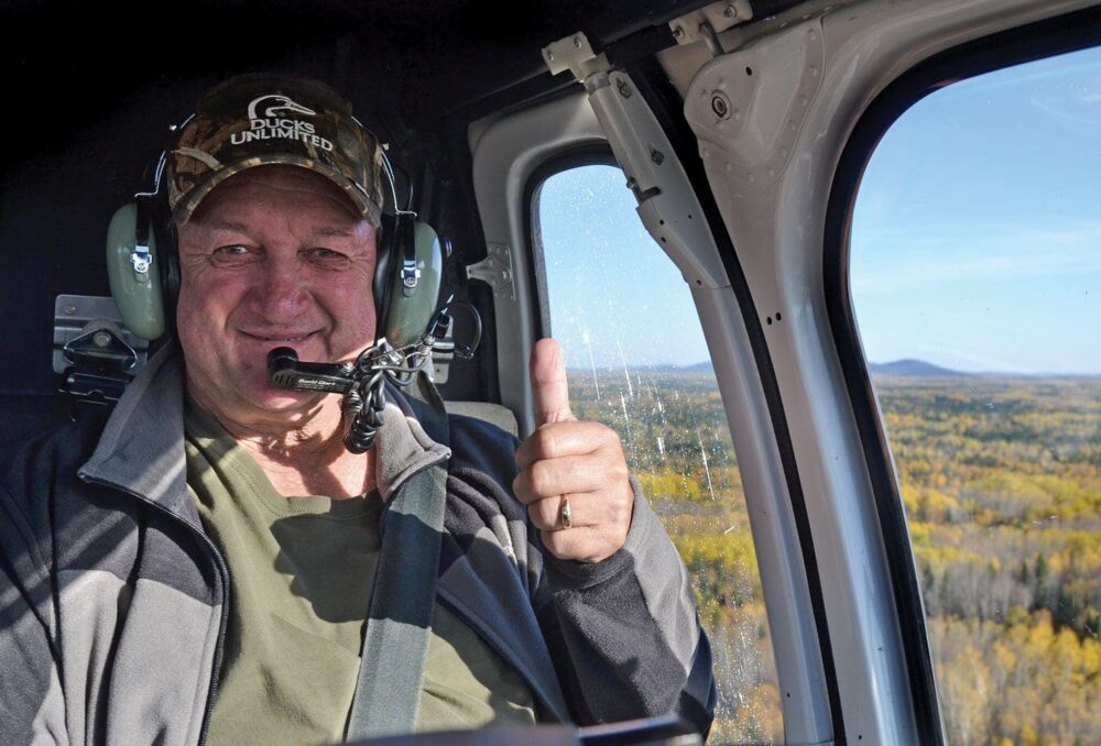 Ontario volunteer Tom Cybolsky, in the air with DUC staff. 