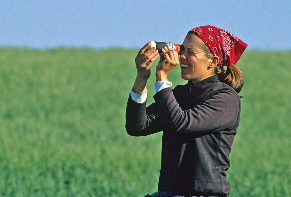A waterfowl biologist uses a field candler to see embryo development.