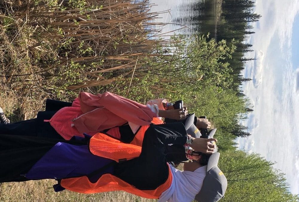 Enthusiastic young students explore a local wetland with DUC.