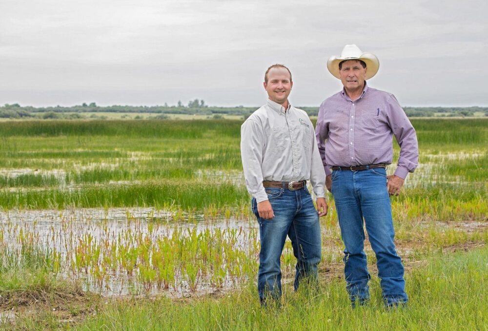 Jonathan Pool, DUC conservation program specialist, and landowner Bob McKnight.