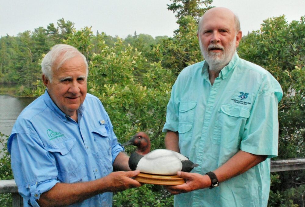 Bruce Batt, PhD, accepts the 2018 NAWMP International Canvasback Award from friend and 2007 award recipient Michael Anderson, PhD.