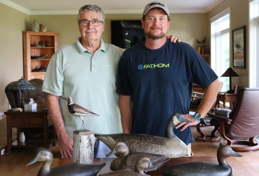 John Latreille and son Kurtis with their purchases from the Peter Brown decoy auctions.