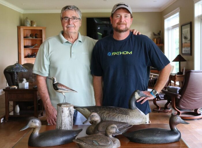 John Latreille and son Kurtis with their purchases from the Peter Brown decoy auctions.