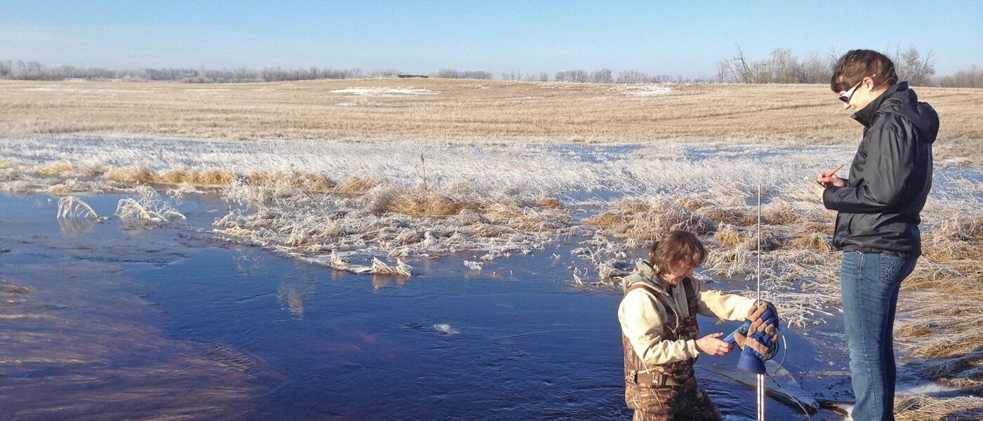 Research scientist Pascal Badiou, in prairie marsh.