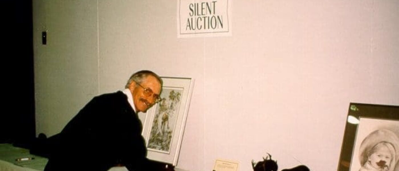 Dale Brydges places an auction bid at a DUC dinner. Brydges was a long-time DUC employee and volunteer for more than four decades.