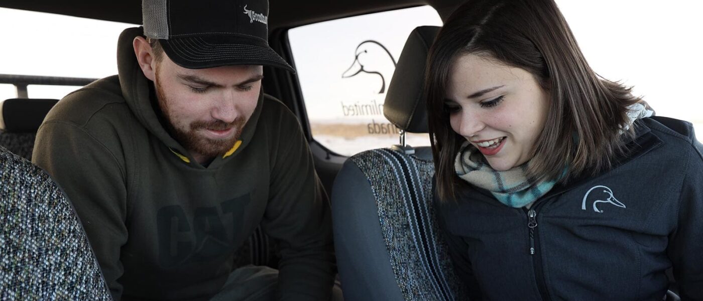 Kale, landowner looking at map in truck