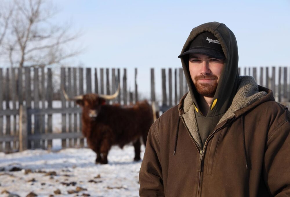  Proudfoot landowner posing with cow in the background