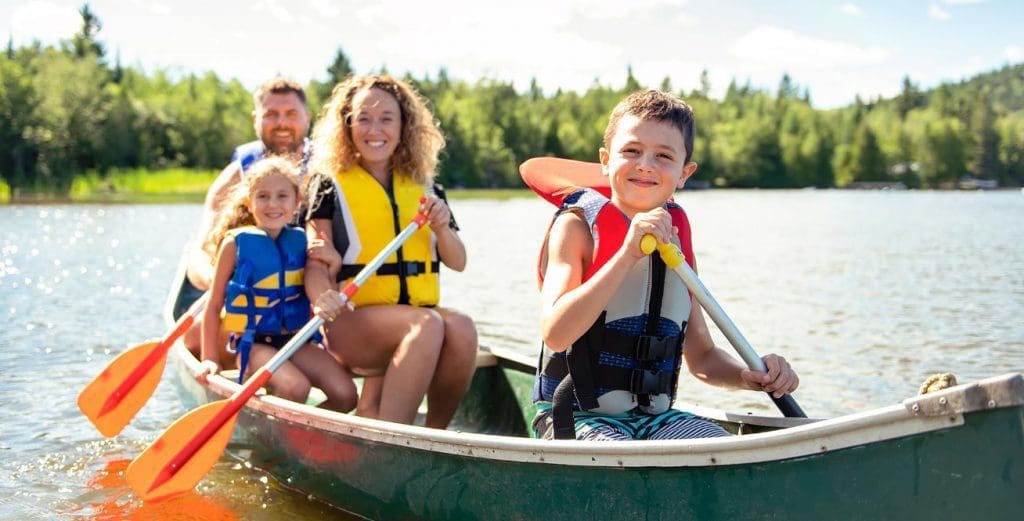 Photo of a family canoeing together