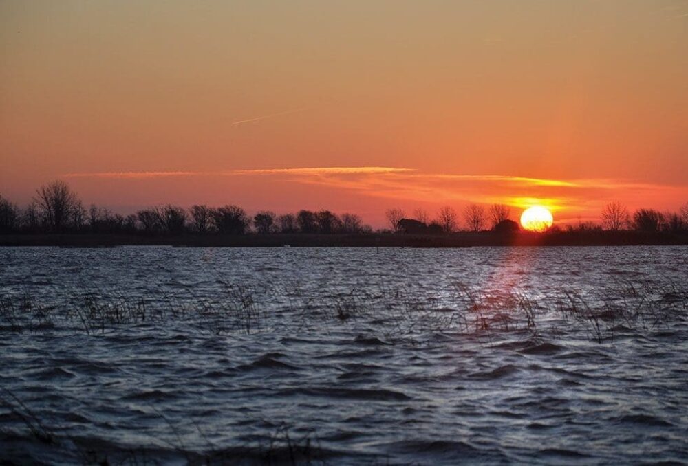 The morning sun rises over wetlands near St. Luke’s Club on the eastern shores of Lake St. Clair. The property was placed on the open market in 2013.