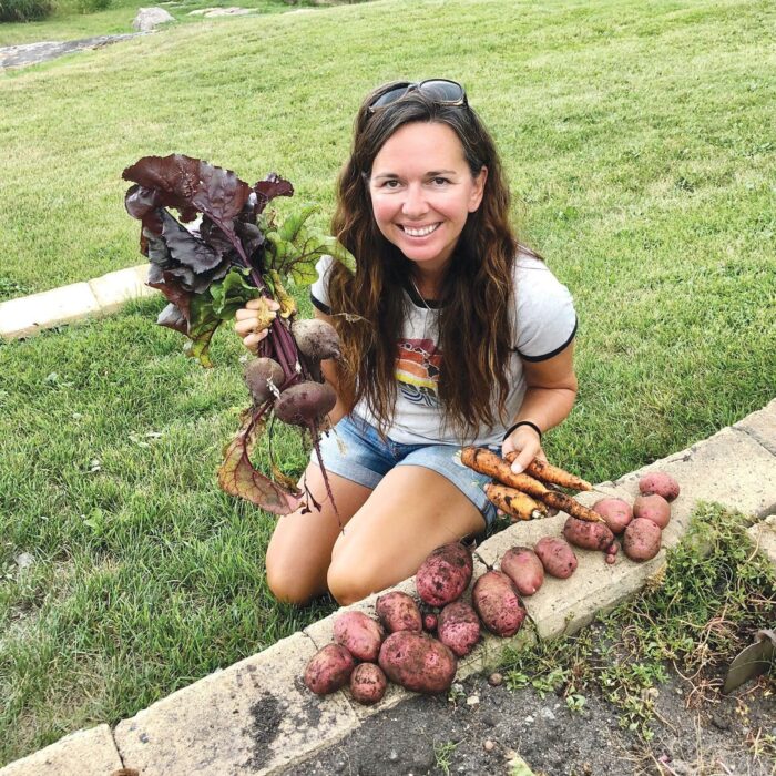 Michelle Trudeau harvests vegetables from her garden at Black Sturgeon Lake, Ont