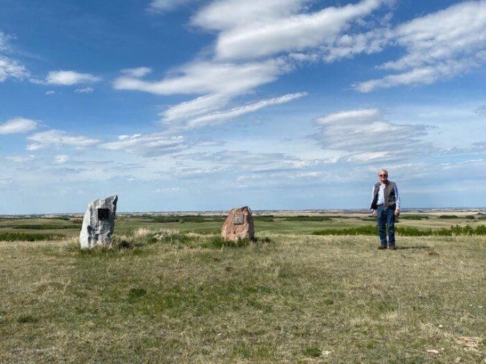 Terry Baker stands alongside the memorials that mark his family’s commitment to conservation