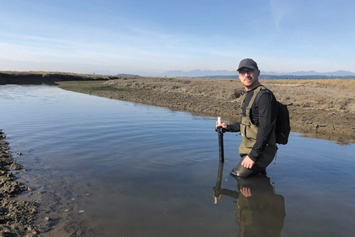 DUC conservation specialist Matt Christensen, immersed in sea-level rise research in B.C.’s Fraser River Delta. 