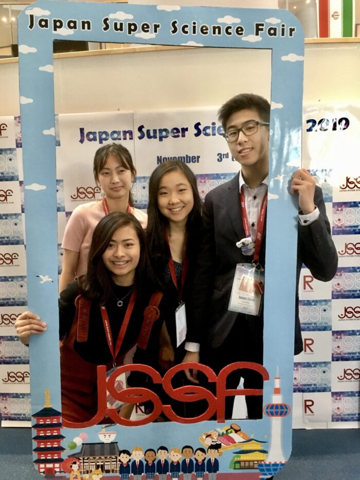 Joyce Ji (middle) presents her wetland research at the 2019 Japan Super Science Fair