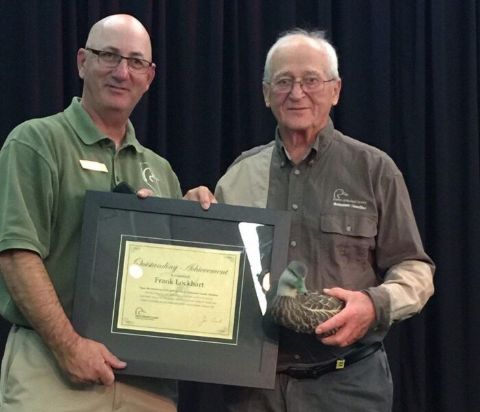 Frank Lockhart (right) is recognized for his dedication as a DUC volunteer. 