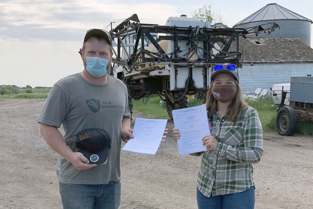 photo shows Alexander-area farmer Bryden Izzard who signed a 70-acre conservation agreement in 2021 with Kylie Nielson from DUC.