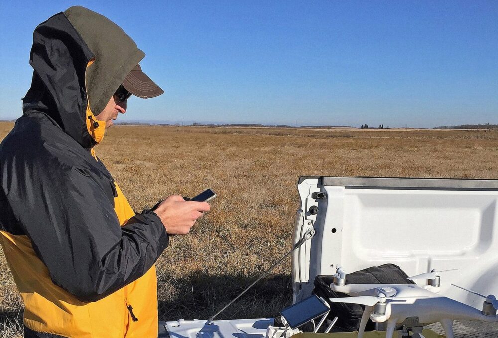 Researcher using a drone in Saskatchewan.