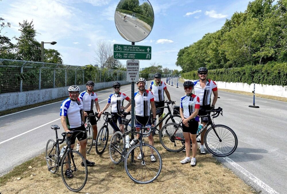 Participants in the 2021 Quebec Ride for Conservation (including Théodore Deezar, far right and Roger d’Eschambault, middle) take a break on the Formula One track in Montreal that was used for their successful event, which raised approximately $35,000 for DUC.