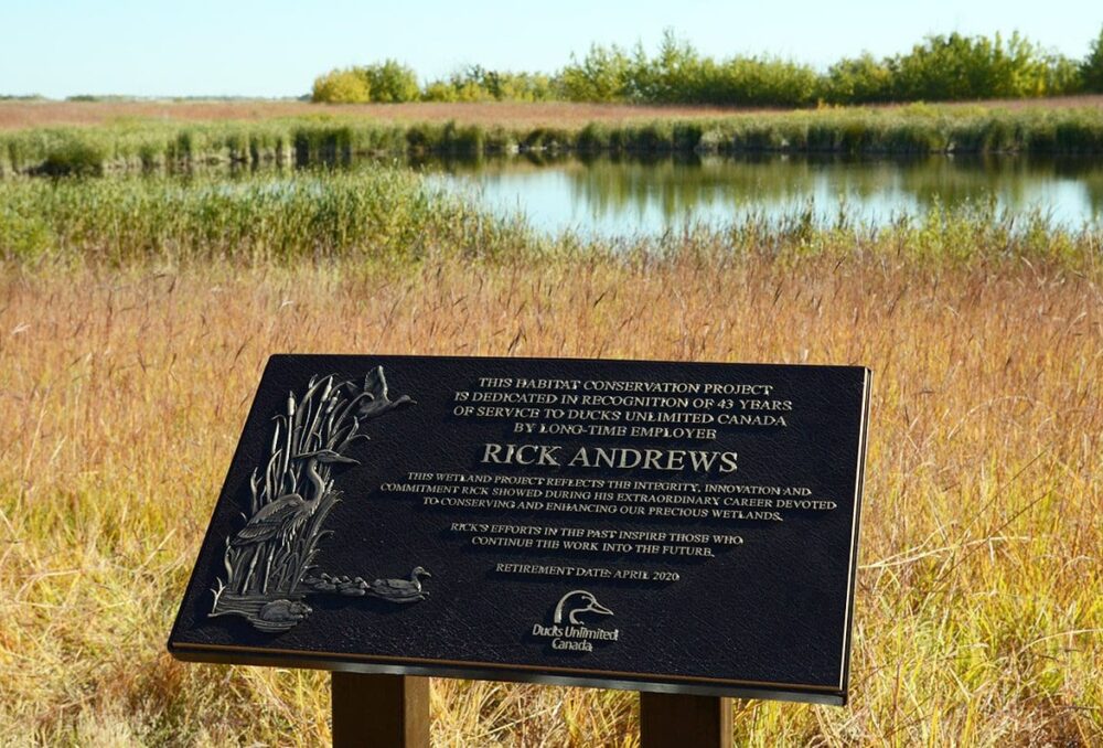A bronze plaque marks the Rick Andrews project north of Brandon, Manitoba.