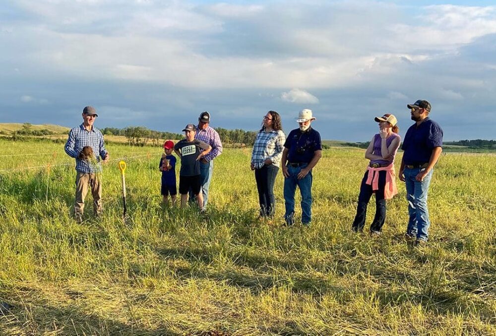 DUC grazing clubs coordinator Mike Thiele leads a farm tour in July 2022 near Lenore, Manitoba.