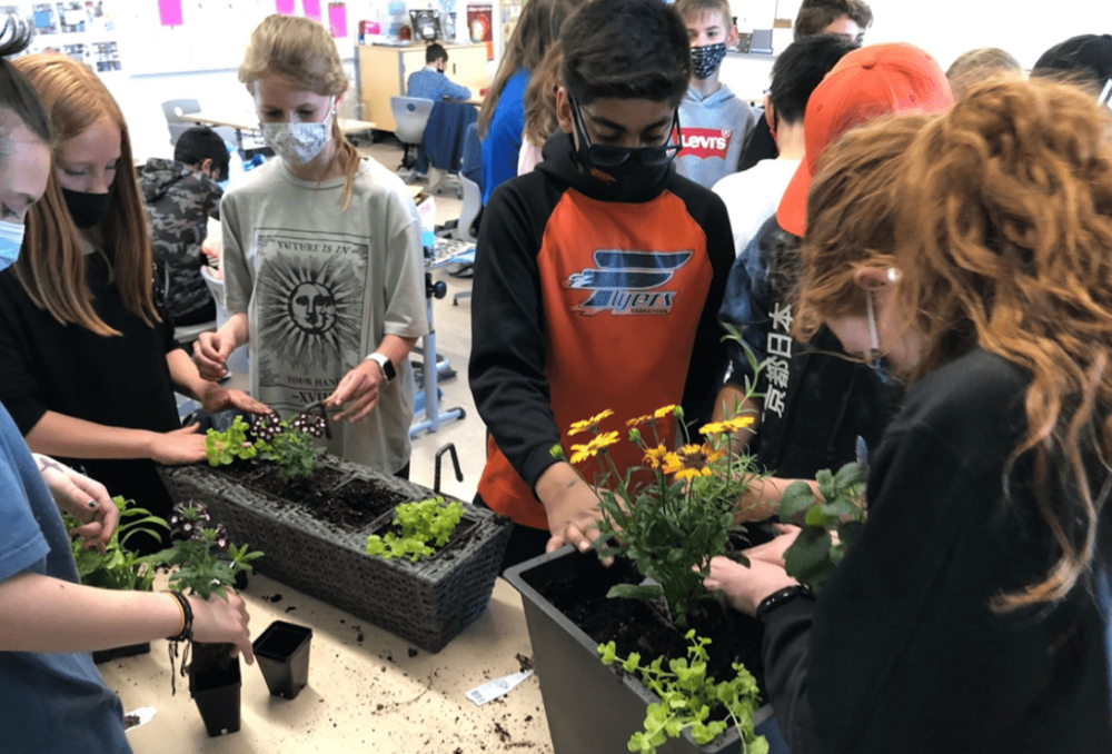 Students from the Saskatoon WCE working on their pollinator planters