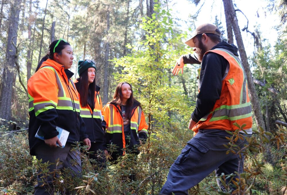 DUC conservation programs specialist Rick Murray describes wetland soil attributes on a field tour with forest industry professionals in Slave Lake, Alberta as part of a knowledge sharing partnership.