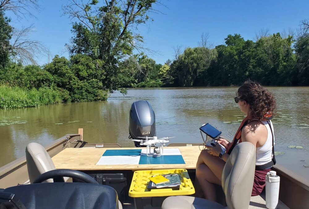 DUC biologists use a drone to capture images of European water chestnut infestations in an Ontario waterway.