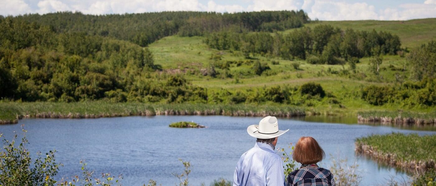 Alberta ranchers view a DUC-restored wetland on their property.