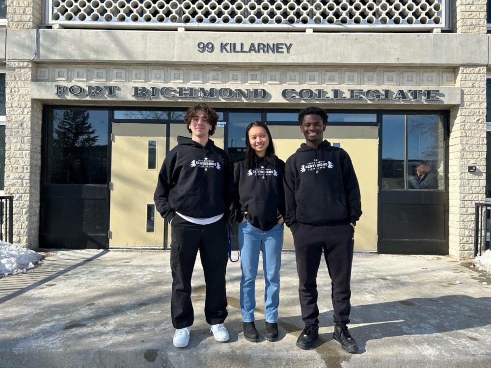 Winning students Sotiris, Ophelia and David pose in front of Fort Richmond Collegiate in Winnipeg, Man.