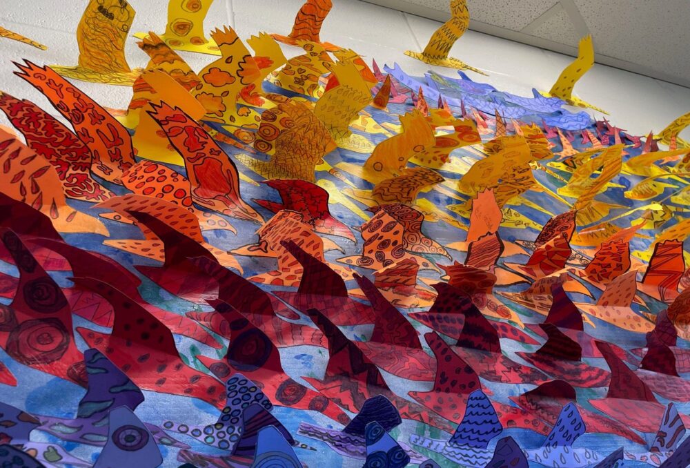 The completed art installation, Water, sustaining bird life, includes roughly 700 paper birds created by students at the Saskatoon WCE. 