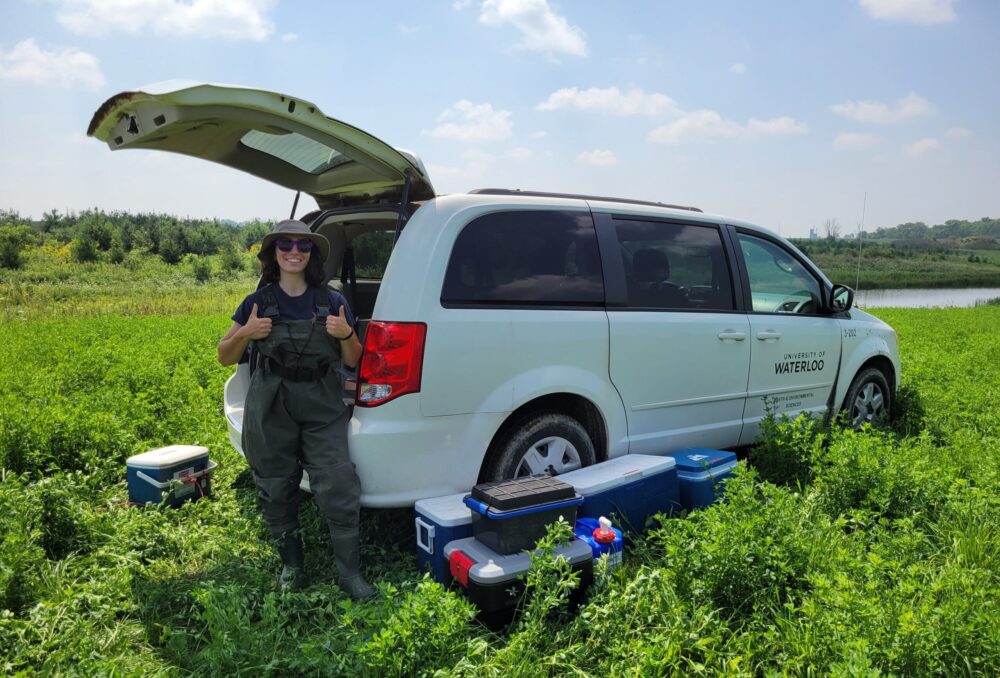 Sara Abate in the field with equipment required for her field work.