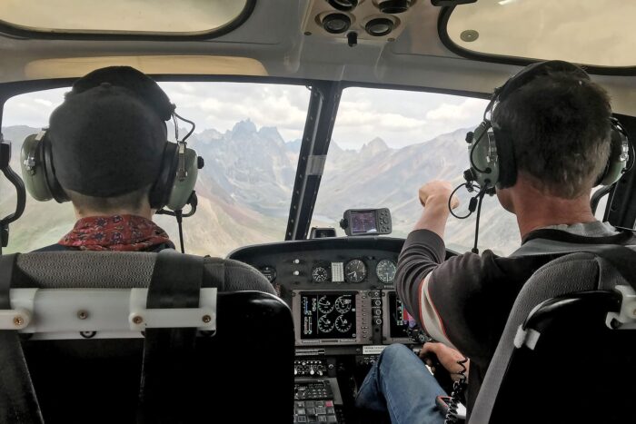 A team of researchers scans a Yukon landscape below as part of an extensive mapping effort in Canada's boreal forest. 