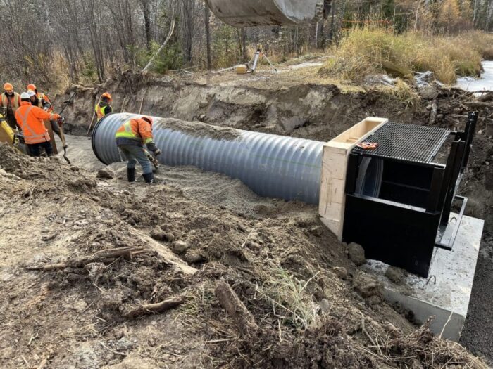 Set into place, the new water structure is fitted with a metal culvert at the Ste. Thérèse wetland, north of Hearst, Ont.