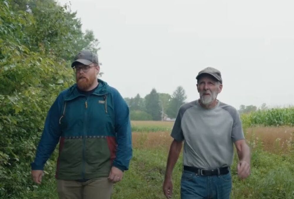 Darryl Hutton (L) is joined by Nick Krete, Ducks Unlimited Canada conservation specialist, on a check-in of the restored wetlands on his southwestern Ontario farmland.