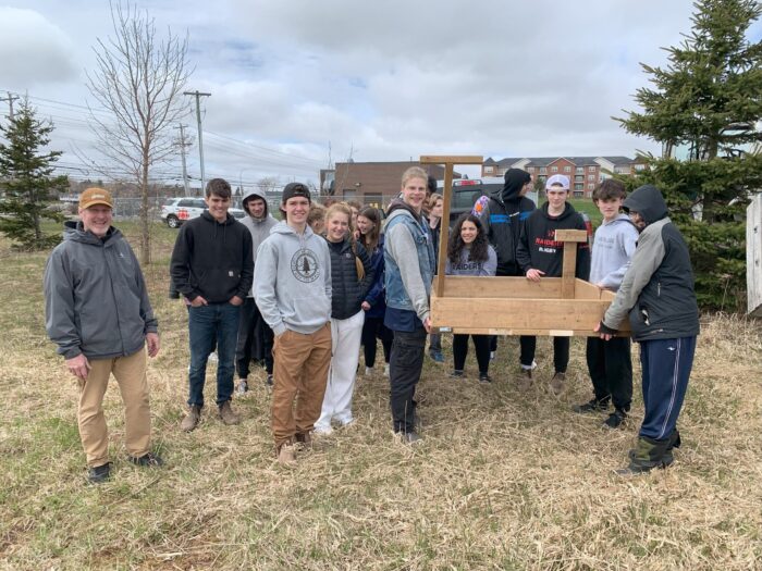Redmond, Geurts and classmates install an osprey platform near Hermitage Creek. 