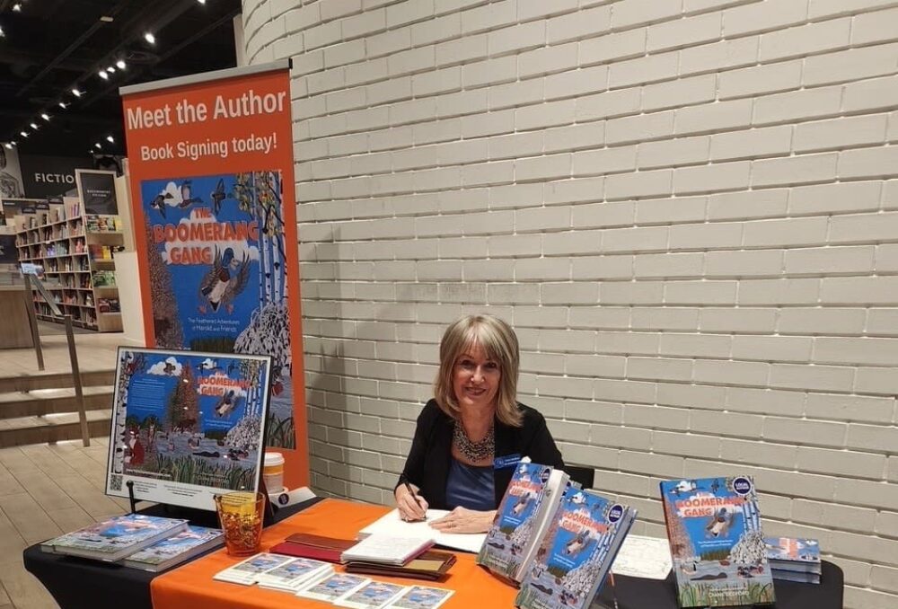 Diane Bedford signs copies of her book 