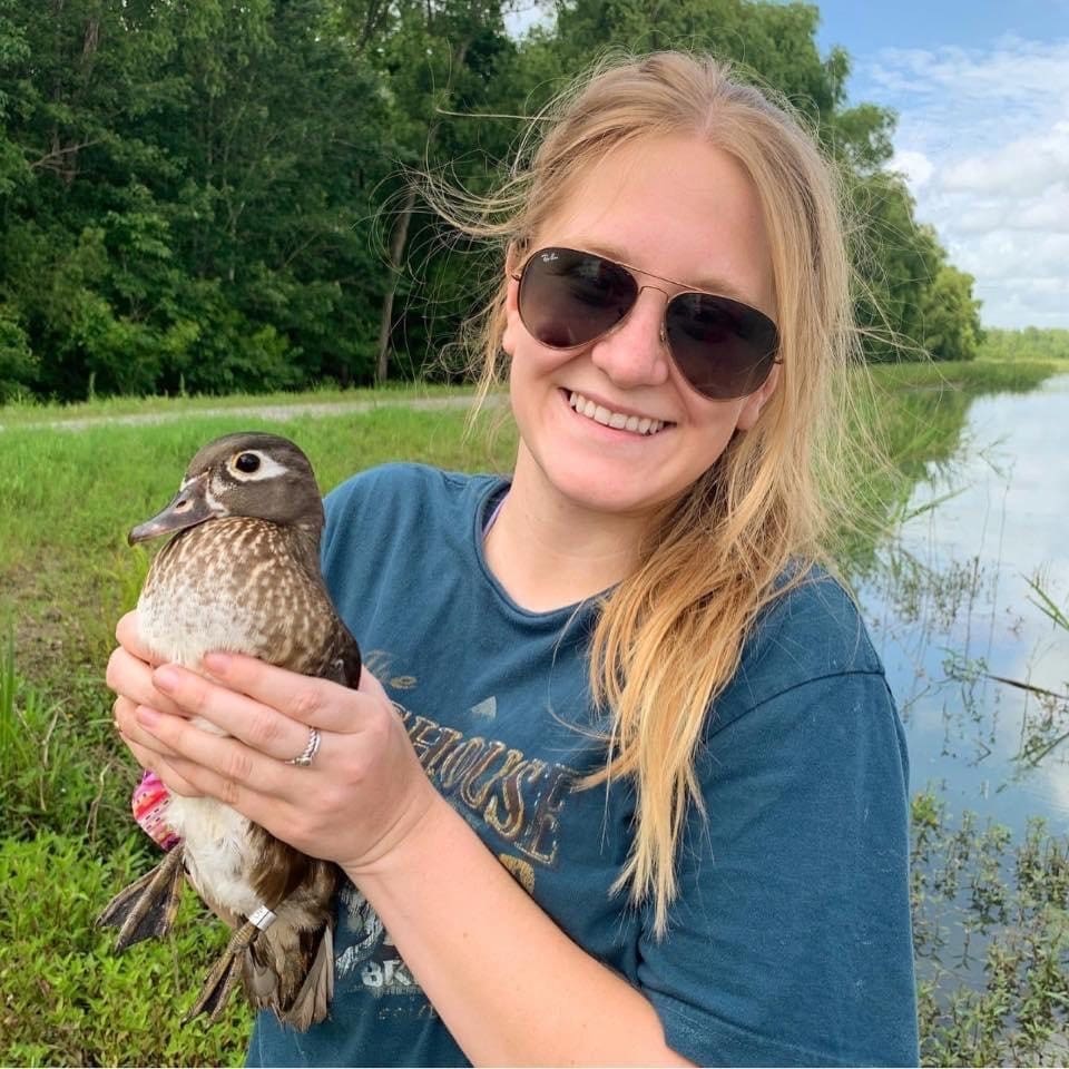 Lauren McFarland holding a wood duck hen