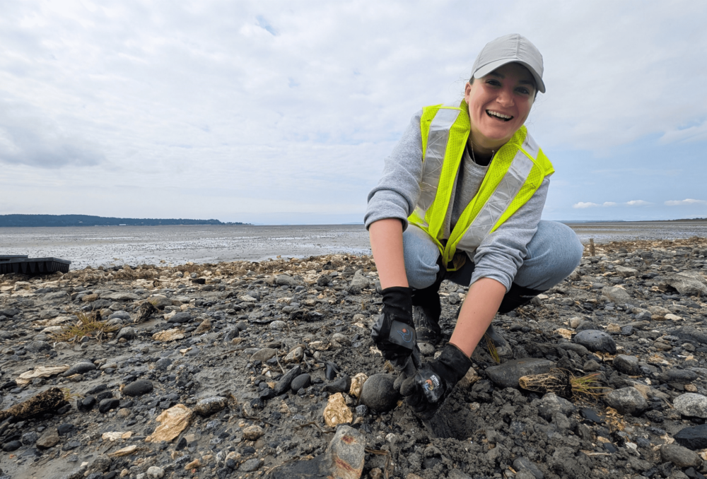 Marina St. Marseille, planting plugs in this image, is a master’s candidate in Coastal Engineering at Queen's University and is analysing data captured as part of the living dike project
