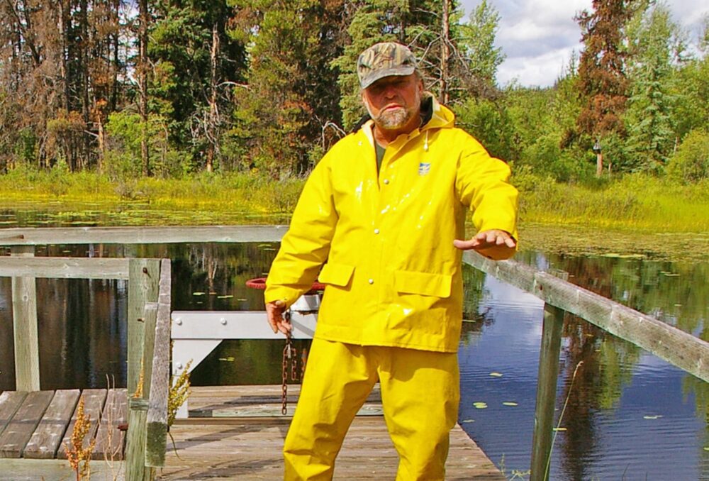 Bernie Wendler stands in front of a water control structure in Wendler Marsh, the land he has managed with DUC for decades.