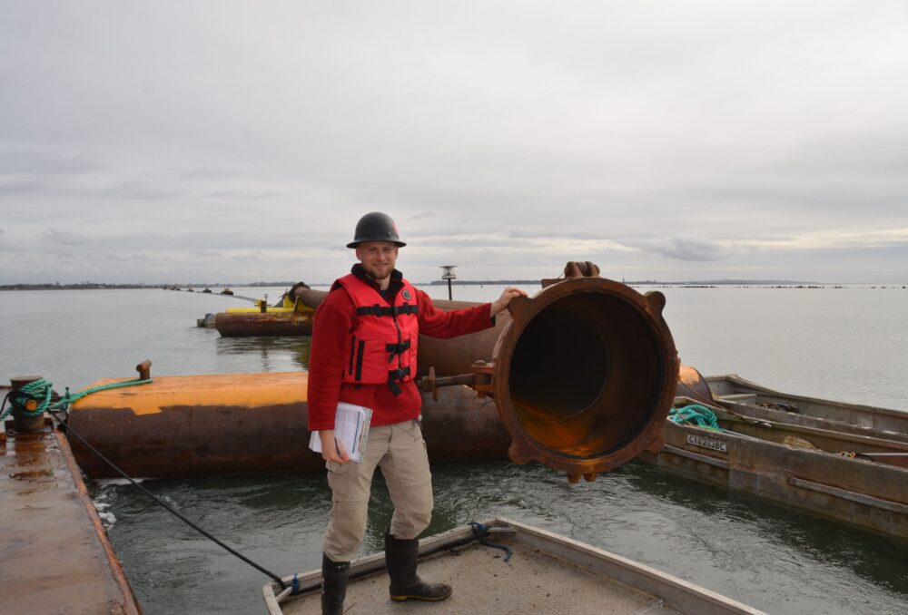 Eric Balke, DUC's senior restoration biologist, has led the project since its inception. He is pictured here next to the delivery pipeline during the assembly process. 