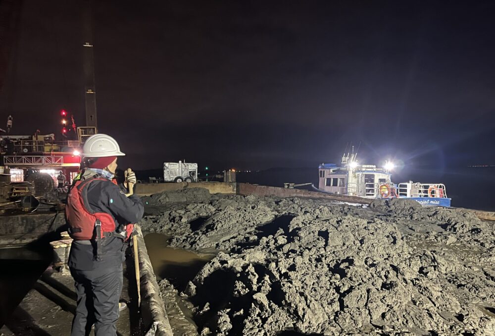 Neville Berard, coastal engineer with Northwest Hydraulic Consultants Ltd., oversees the collection of sediment.