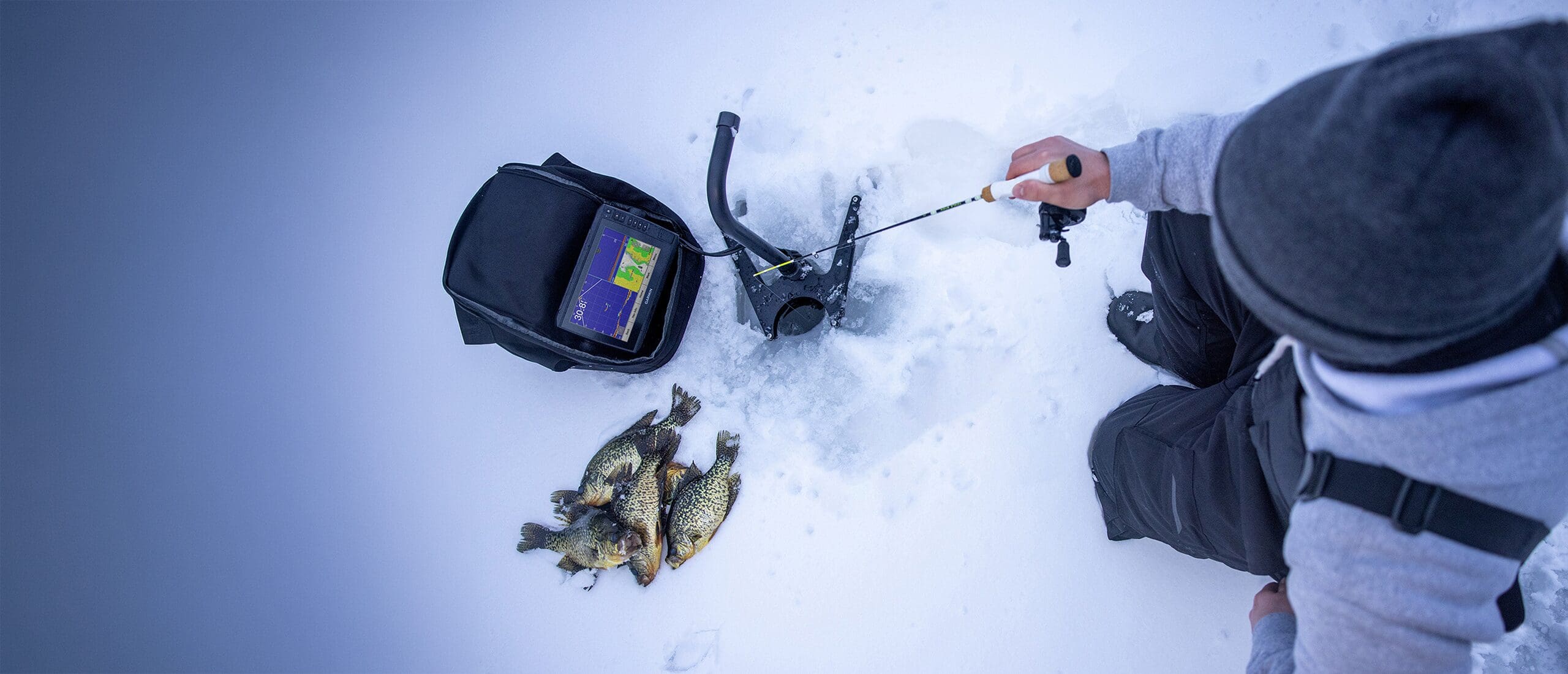 Two people playing pond hockey.