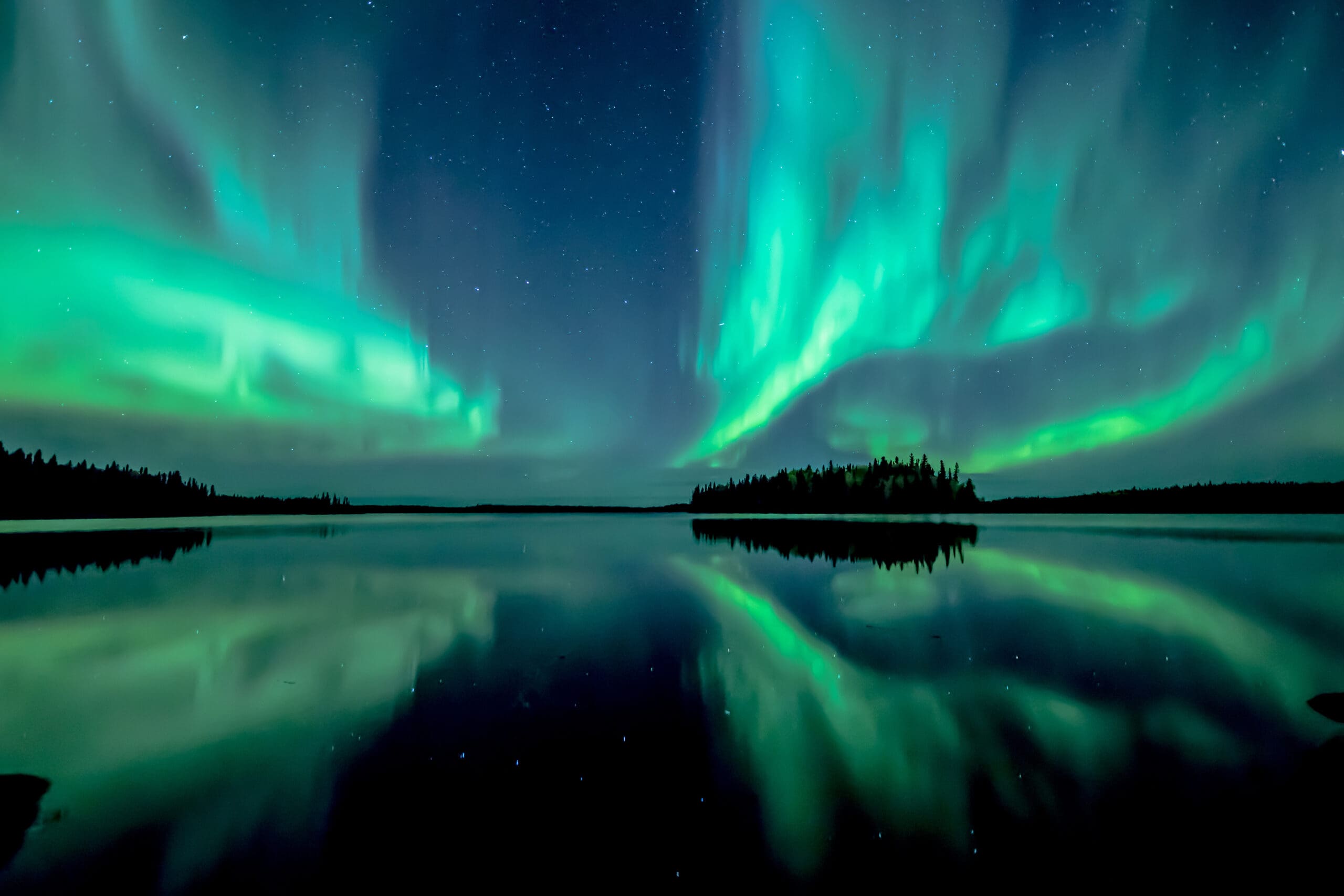 Aurora borealis over a boreal lake.