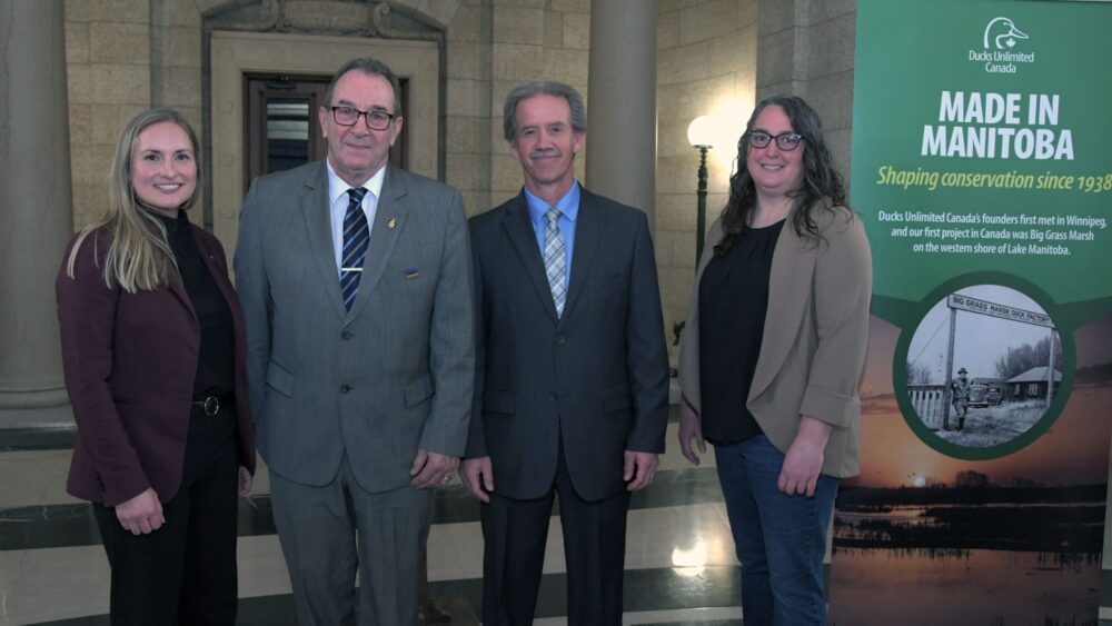 Announcement event at Manitoba Legislature. From left: Karli Reimer, Head of Communications and Outreach (Prairies), Ducks Unlimited Canada; Ron Kostyshyn, Province of Manitoba's Minister of Agriculture; Andrew Hak, Regional Manager of Conservation (Securement), Ducks Unlimited Canada; and Mary-Jane Orr, General Manager, Manitoba Beef & Forage Initiatives.