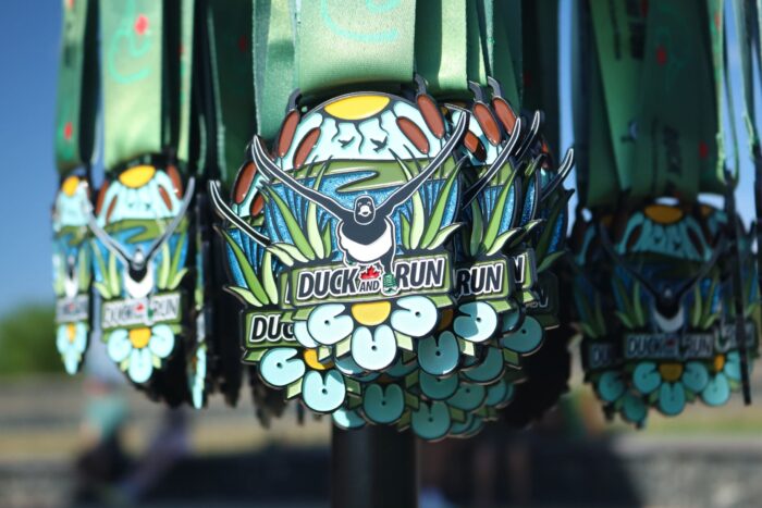 2026 Duck and Run medals, designed by Manitoba artist Justine Proulx.